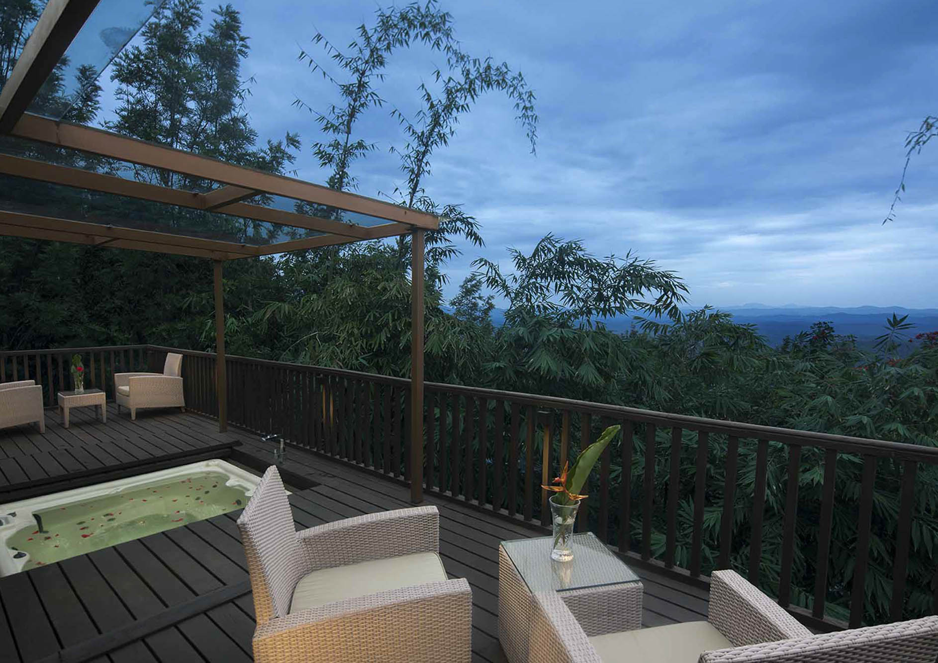 luxury-cottage-with-chairs-and-jacuzzi-with-nature-view