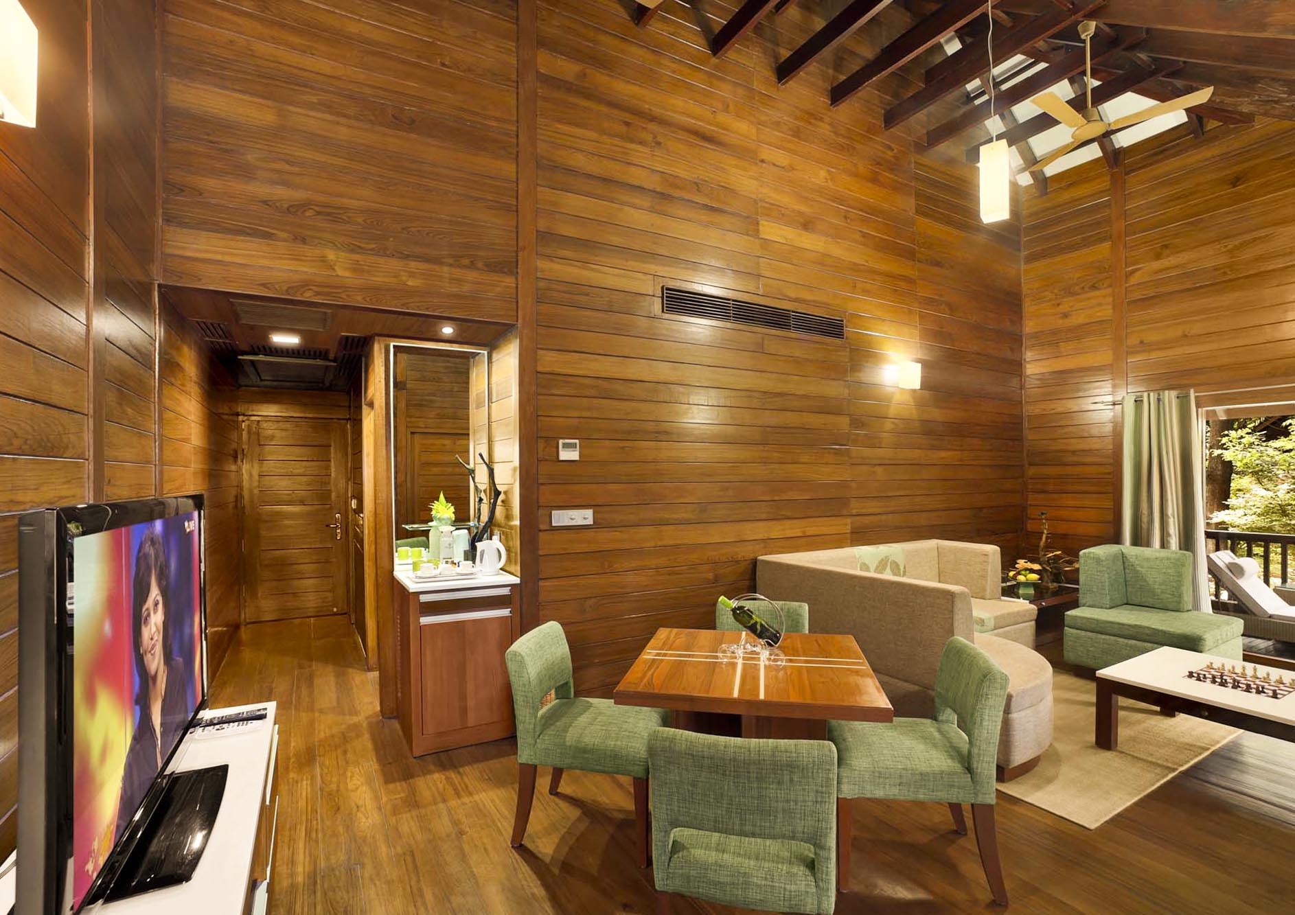 luxury-cottage-interior-with-chair-and-sofa-and-tv-nature-view