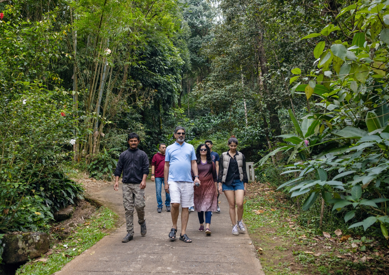 Group of people walking in The Tamara Coorg
